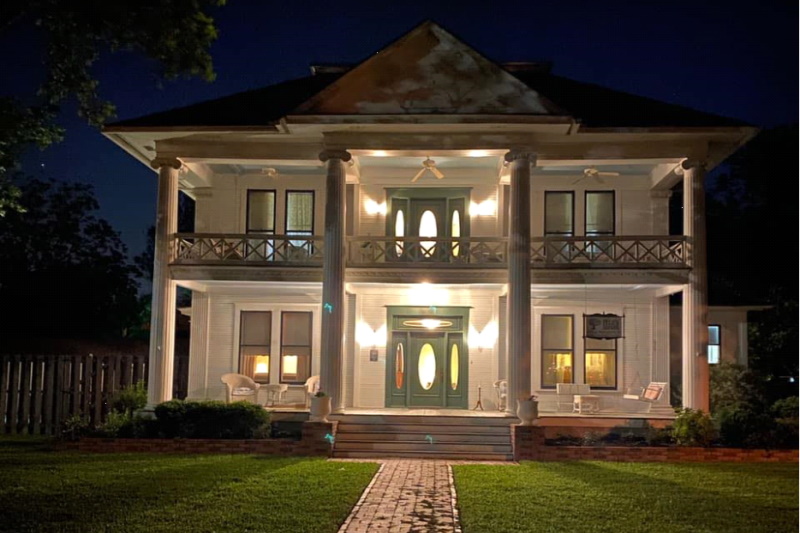 Front image of the manor at night